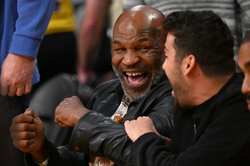 Kako je Mike Tyson odreagiral, ko je neznanec v lokalu potegnil pištolo (foto: Profimedia)