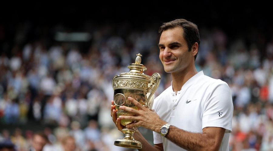 FOTO: Federer v mlajših letih oboževal Jordana, na vrata otroške sobe pa nalepil plakat prsate zvezdnice (foto: Profimedia)